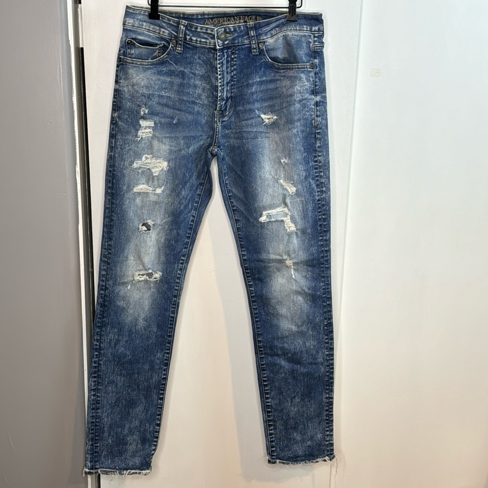Woman’s American Eagle, slim, mid-rise, factory distressed, extreme flex, 32/34